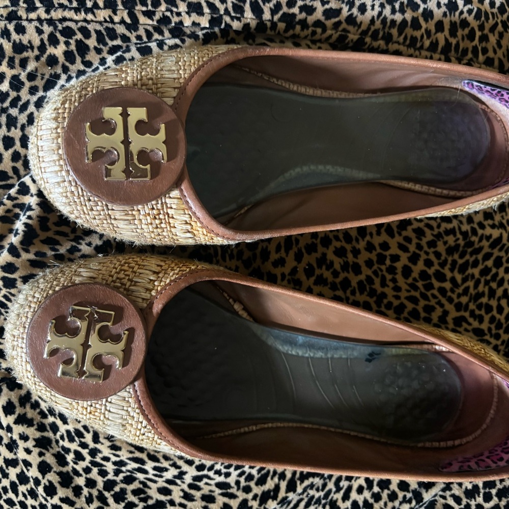 Tory Burch beige material flats . Beige with dark tan leather on rim of shoes .
